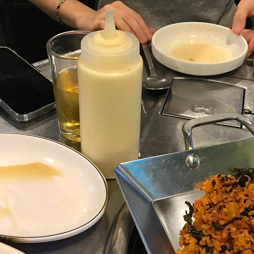 Kkakdugi fried rice served with a whole tub of mayonnaise