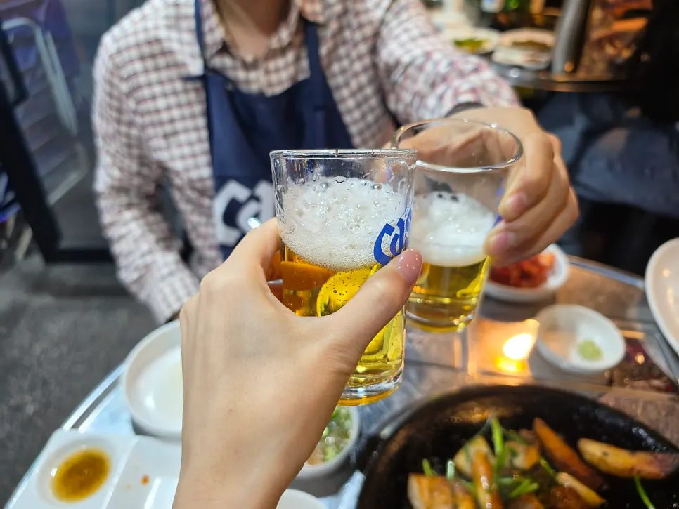 Beer cheers during the gopchang meal
