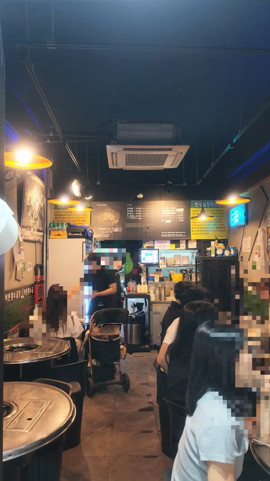 Sign promoting gopchang, draft beer, and Buldak Ttongttongmyeon