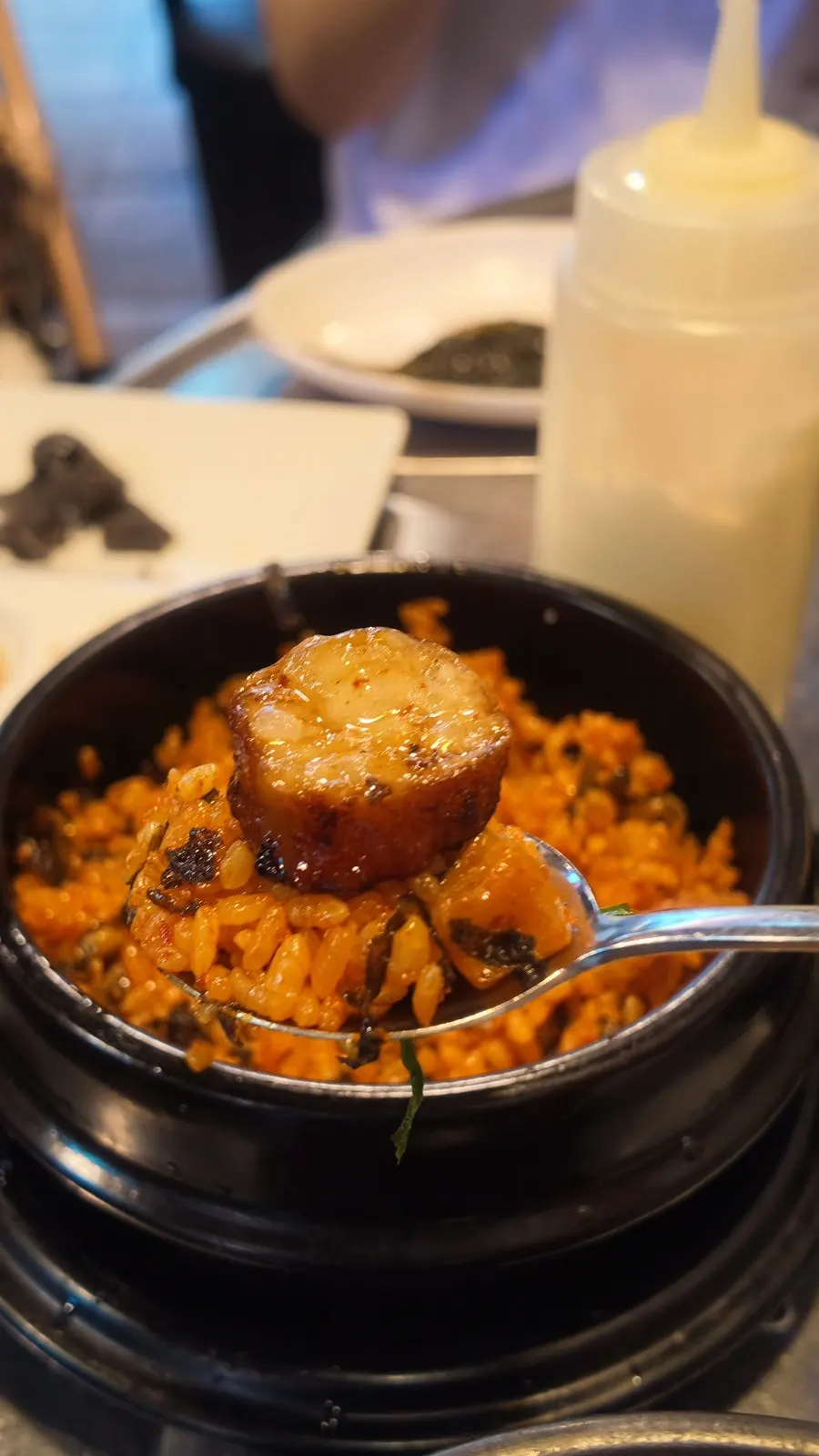 Gopchang fried rice with roasted seaweed flakes