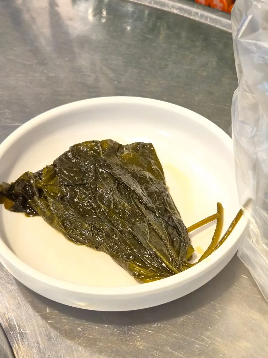 Table setting with complimentary cheonyeop and pickled perilla leaves