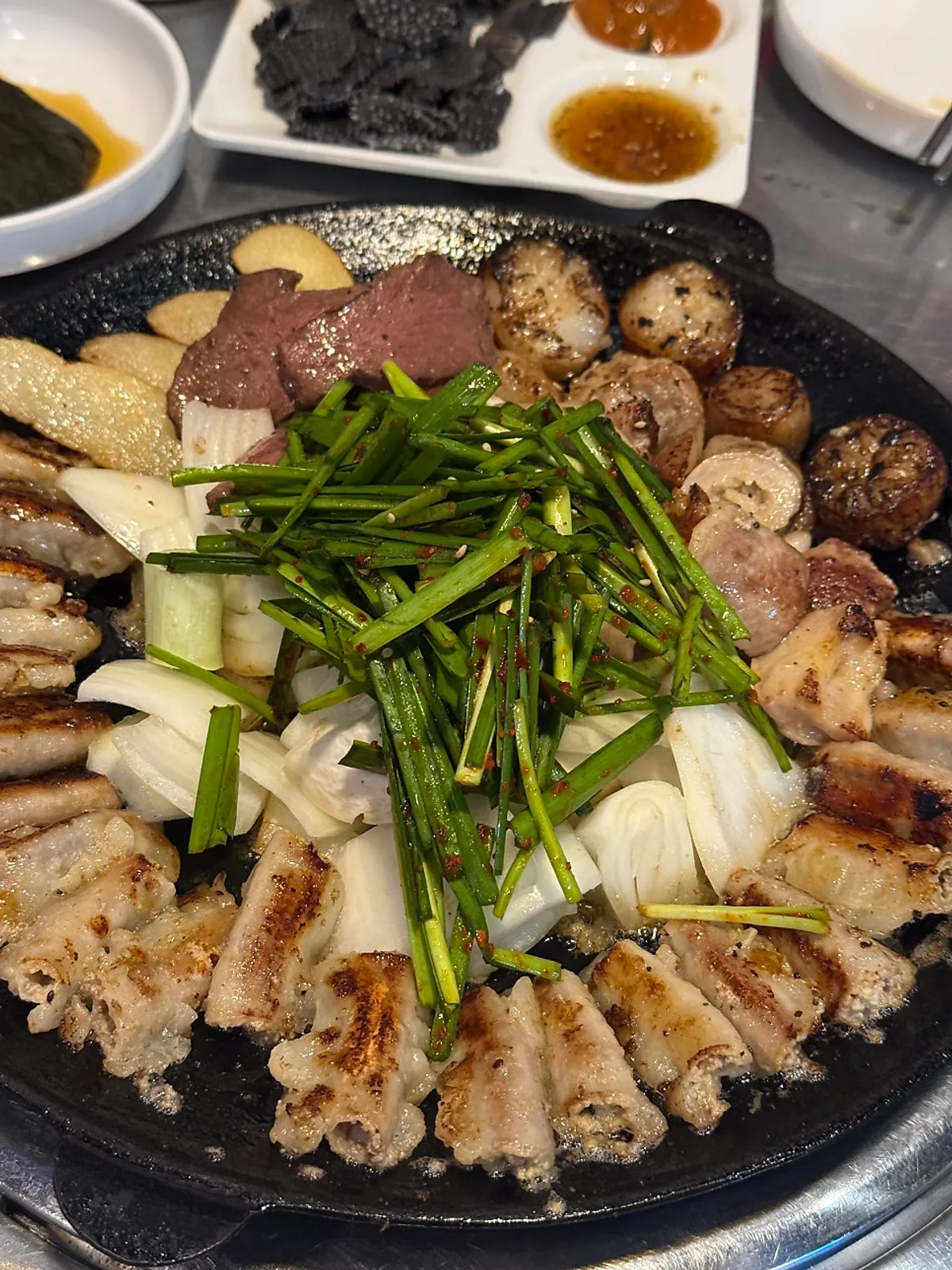 Full spread of assorted intestines and Korean beef gopchang