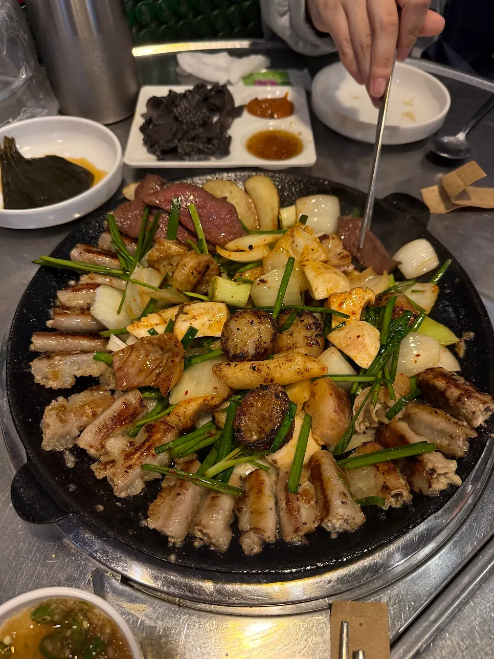 Assorted beef intestines turning golden as they cook