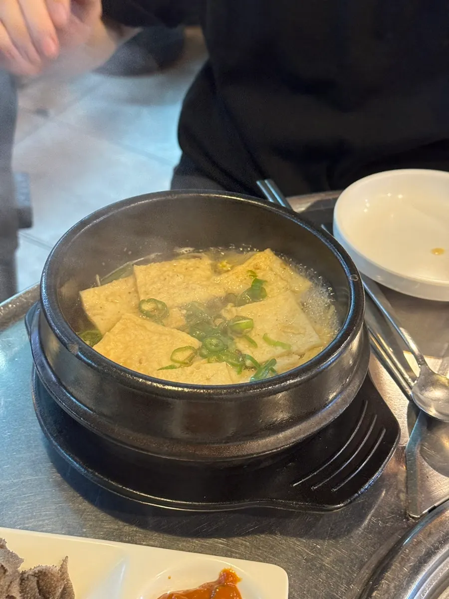 Pot of fish cake soup served as a free side
