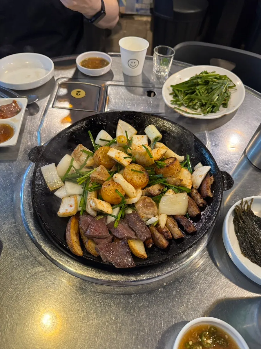 Gopchang, daechang, makchang, and heart on the grill