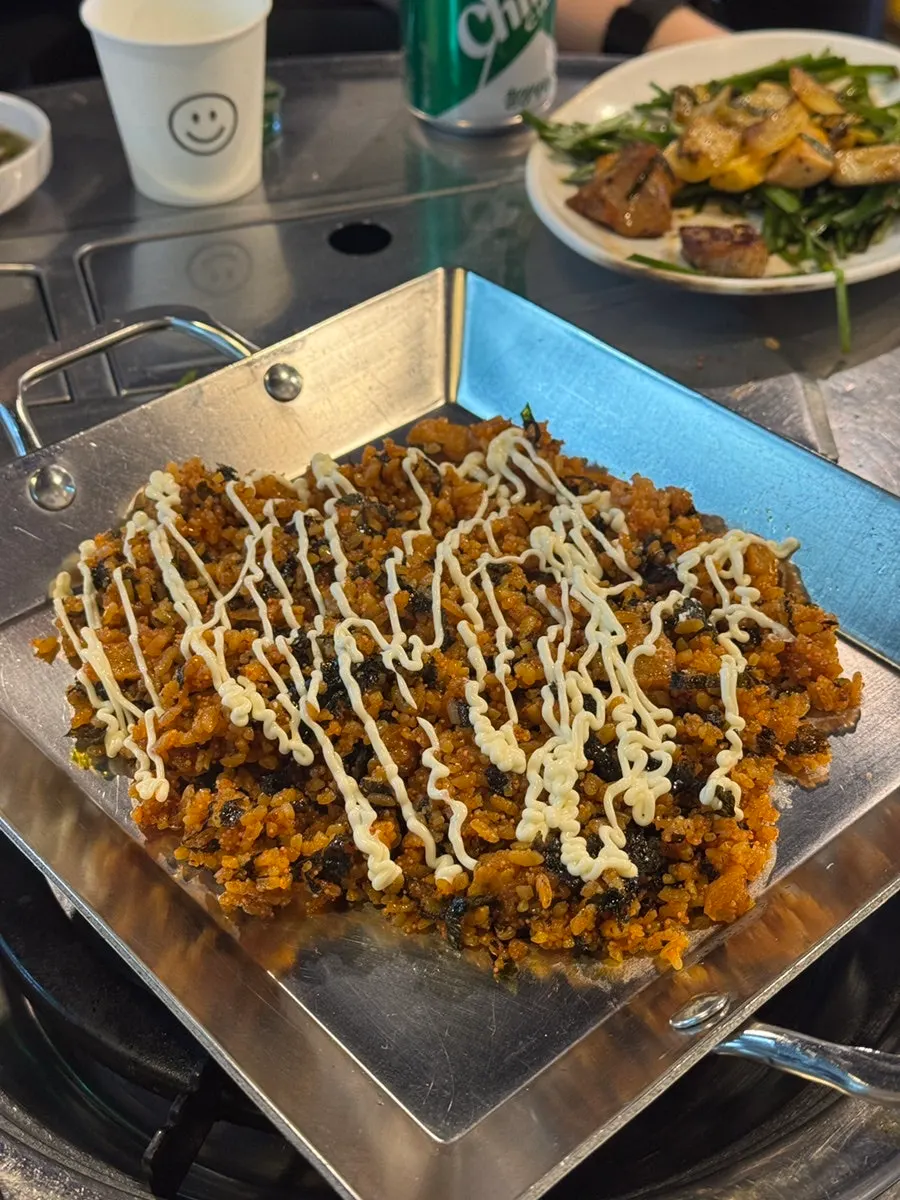Kkakdugi fried rice starting to cook on the hot plate