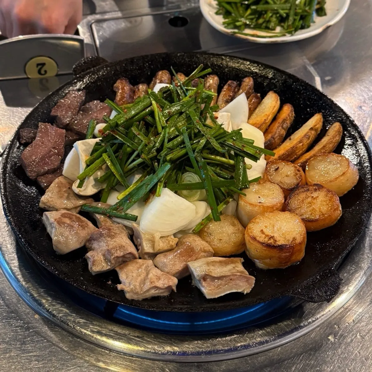 Full spread of assorted gopchang at Bareun Hwangso Gopchang
