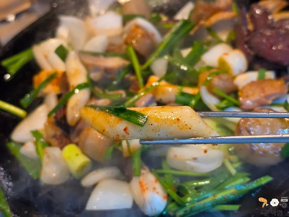 Gopchang side dish with a glass of soju-beer