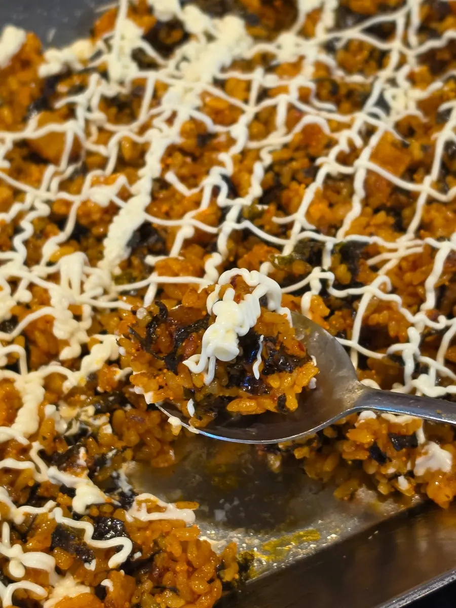 Kkakdugi fried rice topped generously with mayonnaise