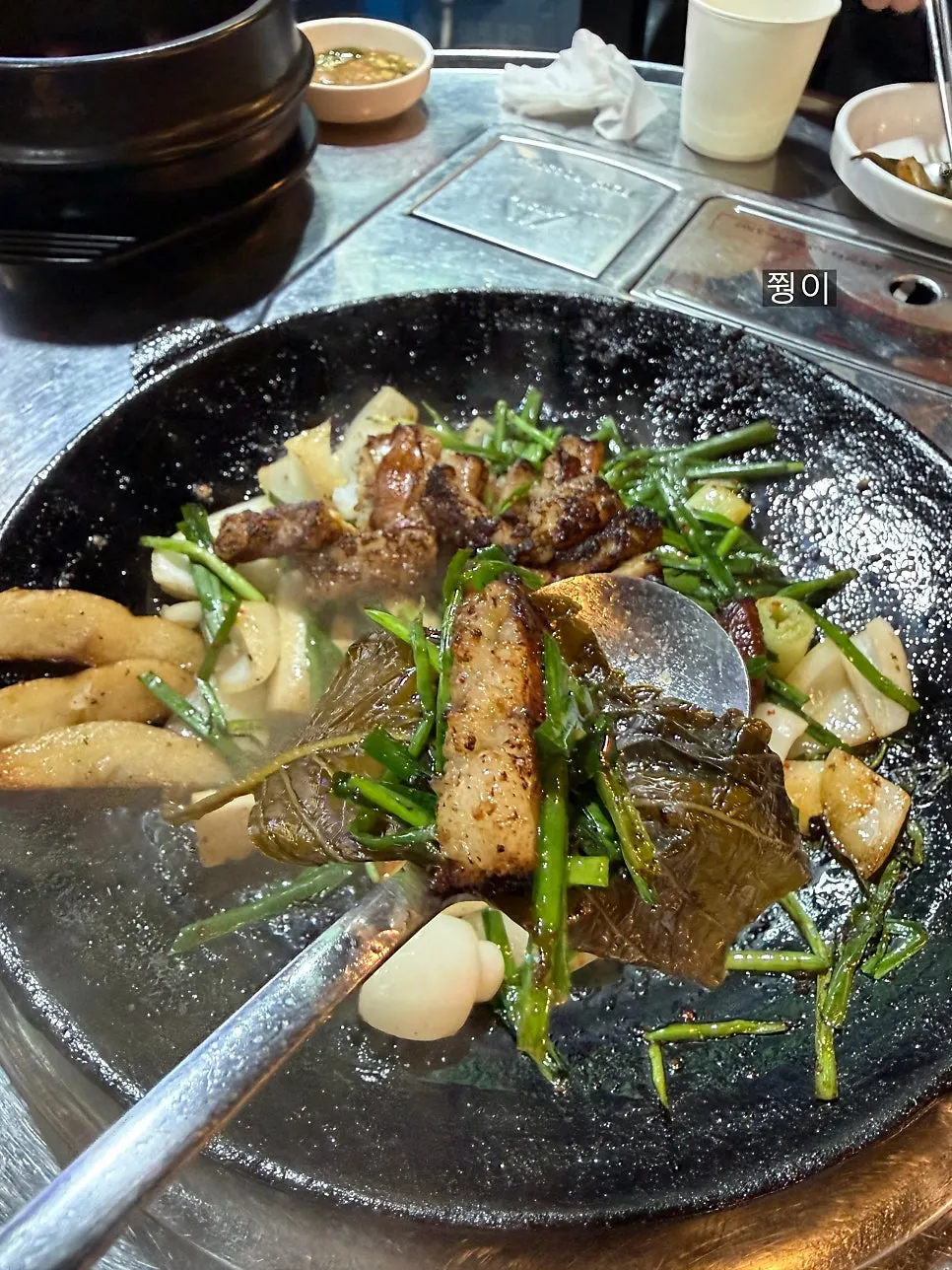 Hanwoo gopchang cooking on the grill pan