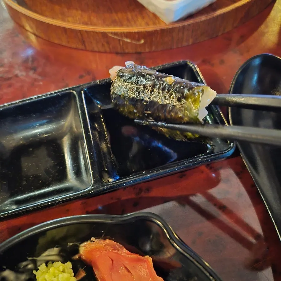 Flounder sashimi wrapped in seaweed