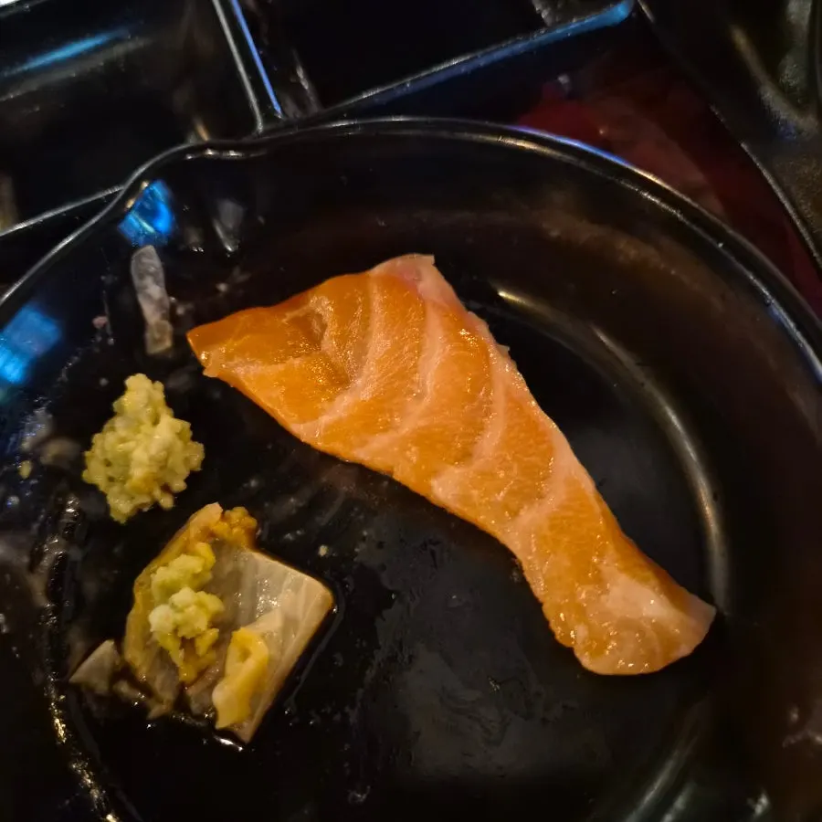 Salmon sashimi wrapped in seaweed