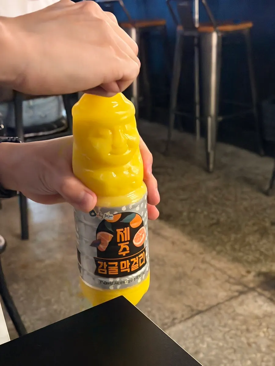 Mixing Jeju tangerine makgeolli