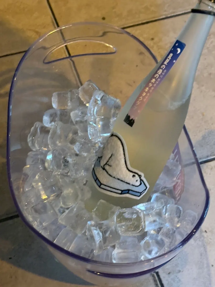 Sake in an ice bucket with glasses