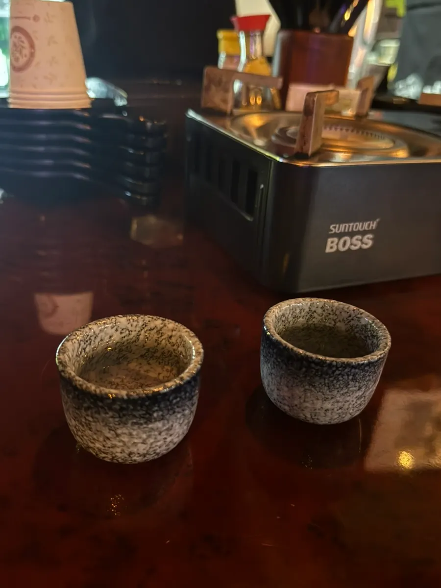 A glass of sake served as a welcome drink