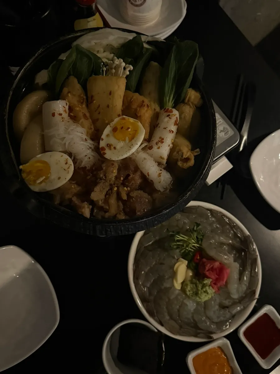 Table spread with raw shrimp sashimi and seoji-oden