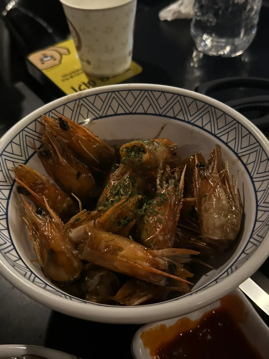 Crispy fried shrimp heads served at the table