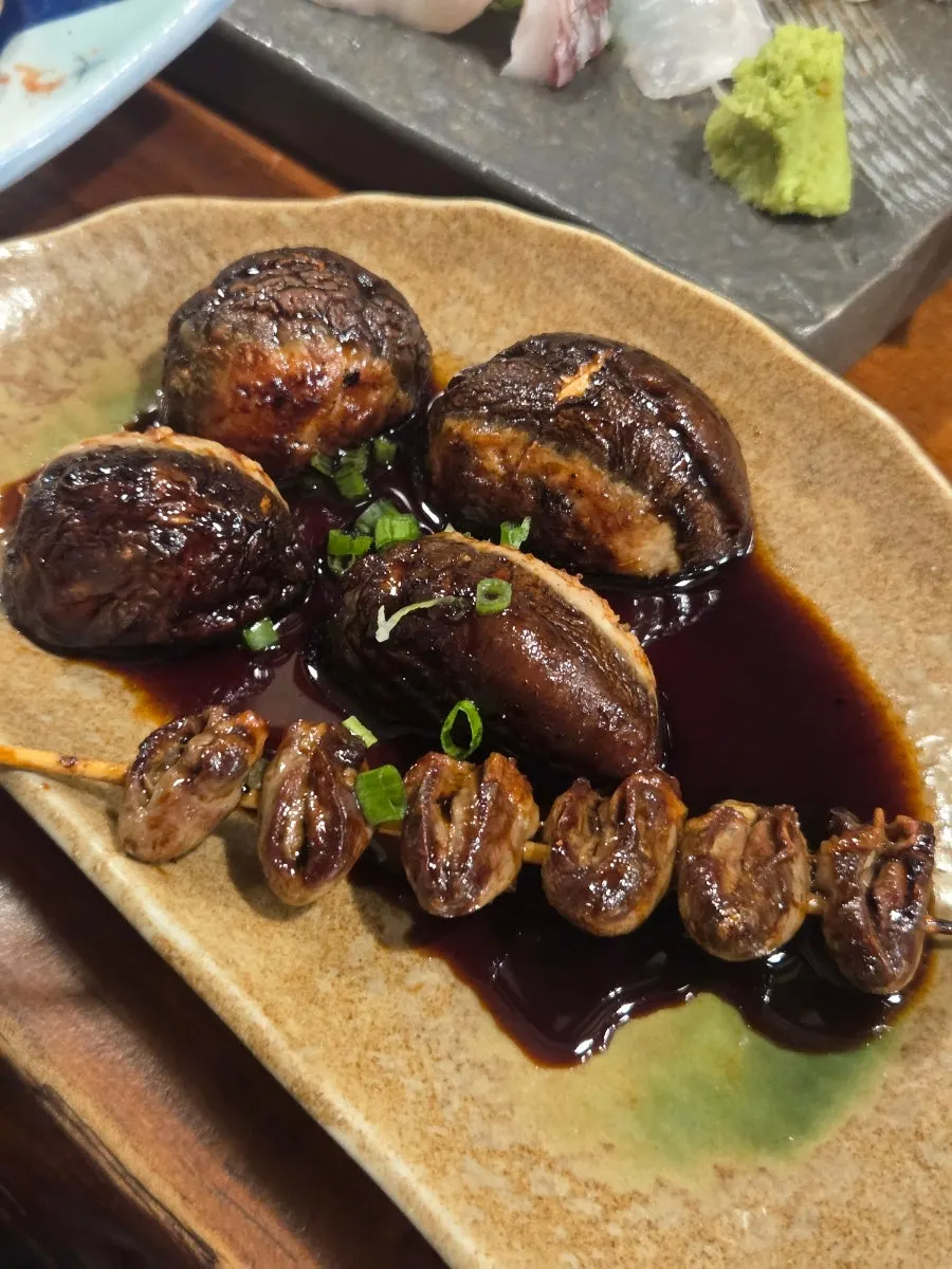 Five-piece assorted skewers with bacon-wrapped king trumpet mushroom and chicken wings