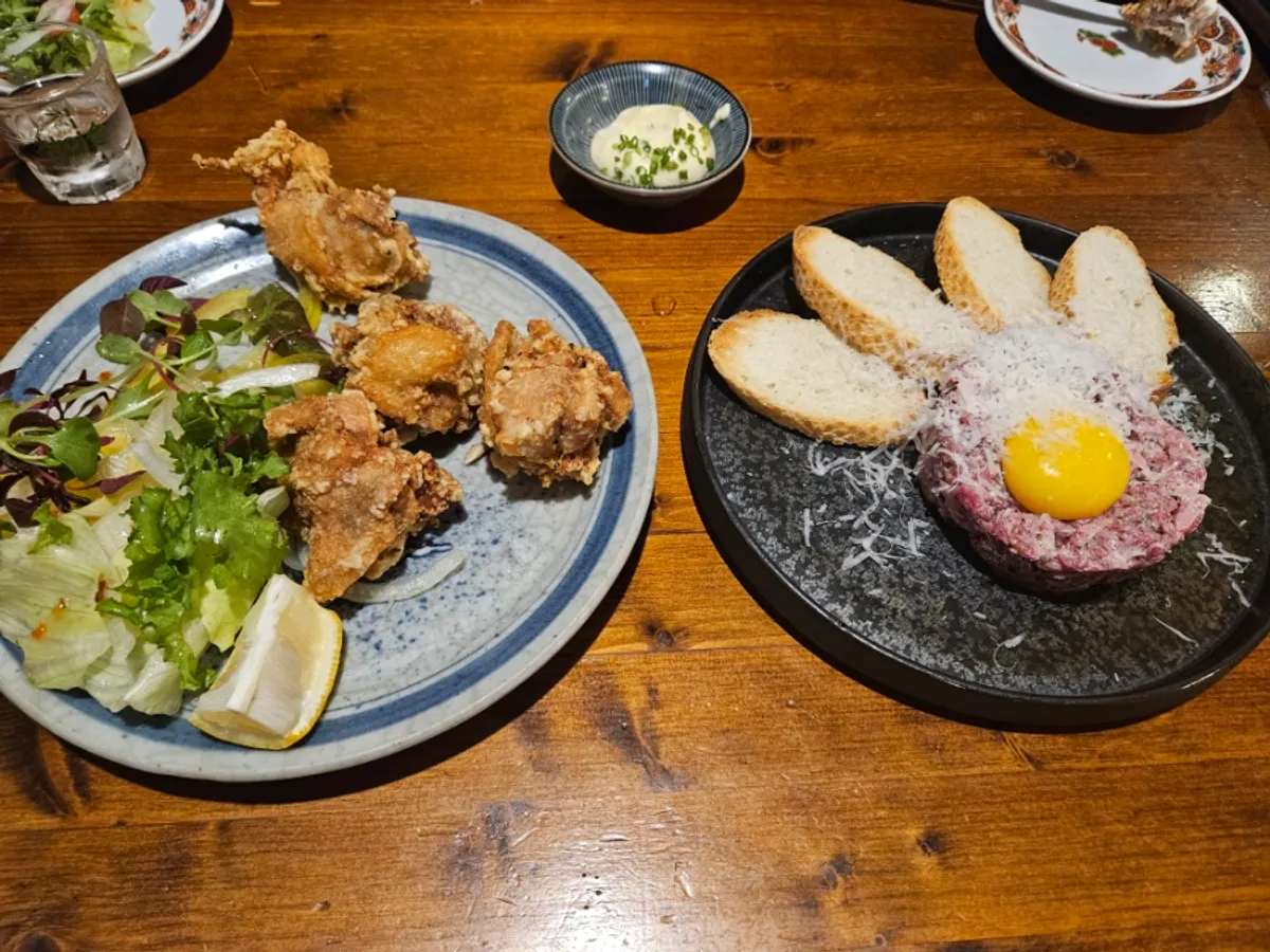 Table set with truffle hanwoo yukhoe and chicken karaage together