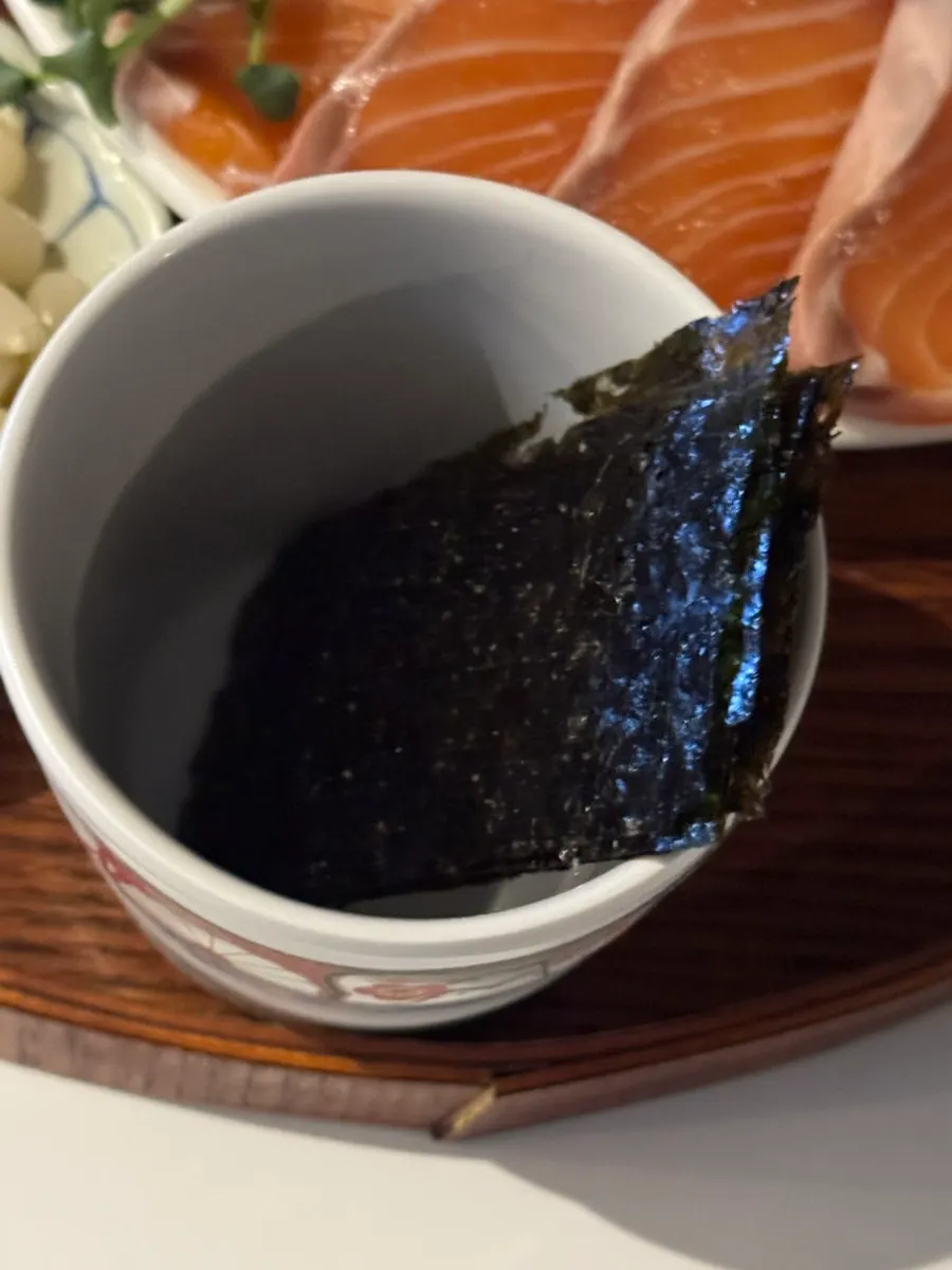 Seaweed and sauces served with the sashimi