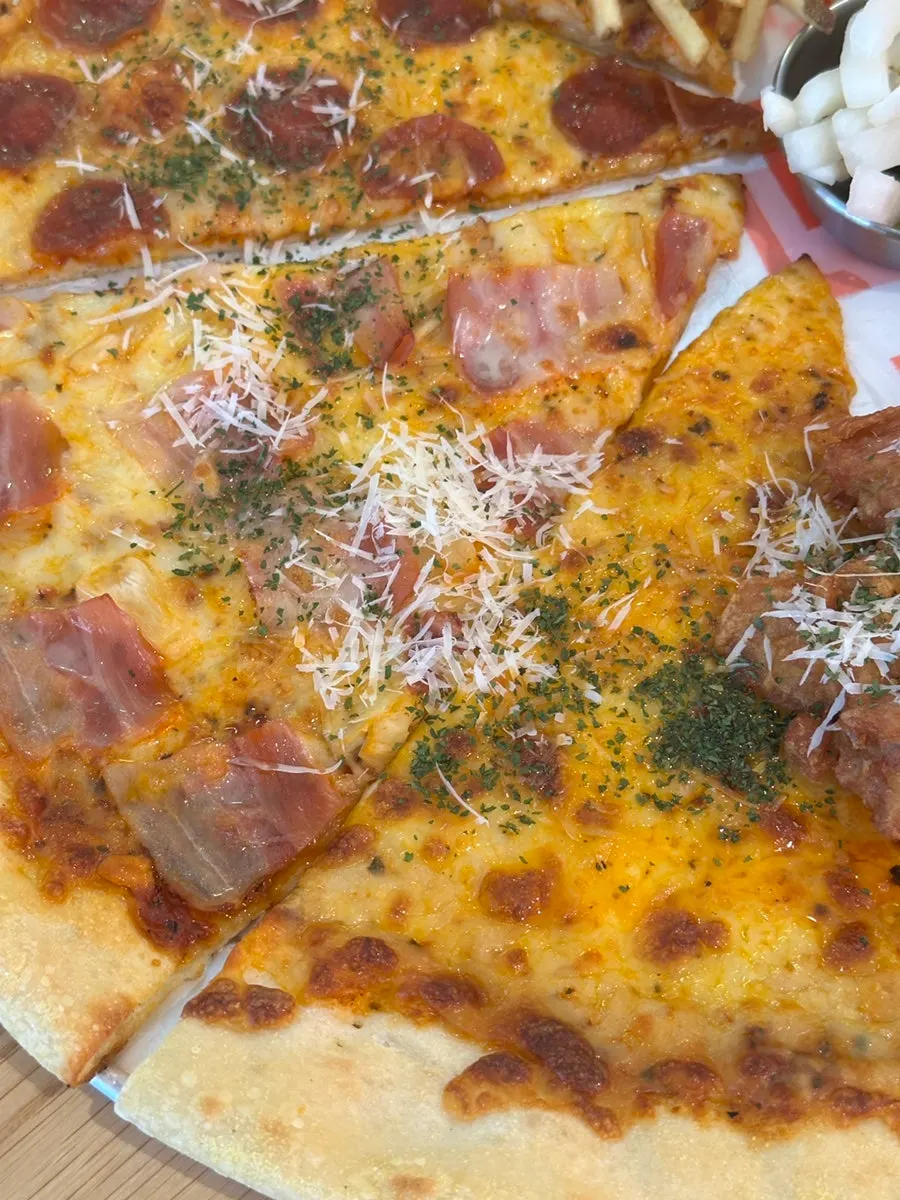 Slice of bacon Hawaiian pizza