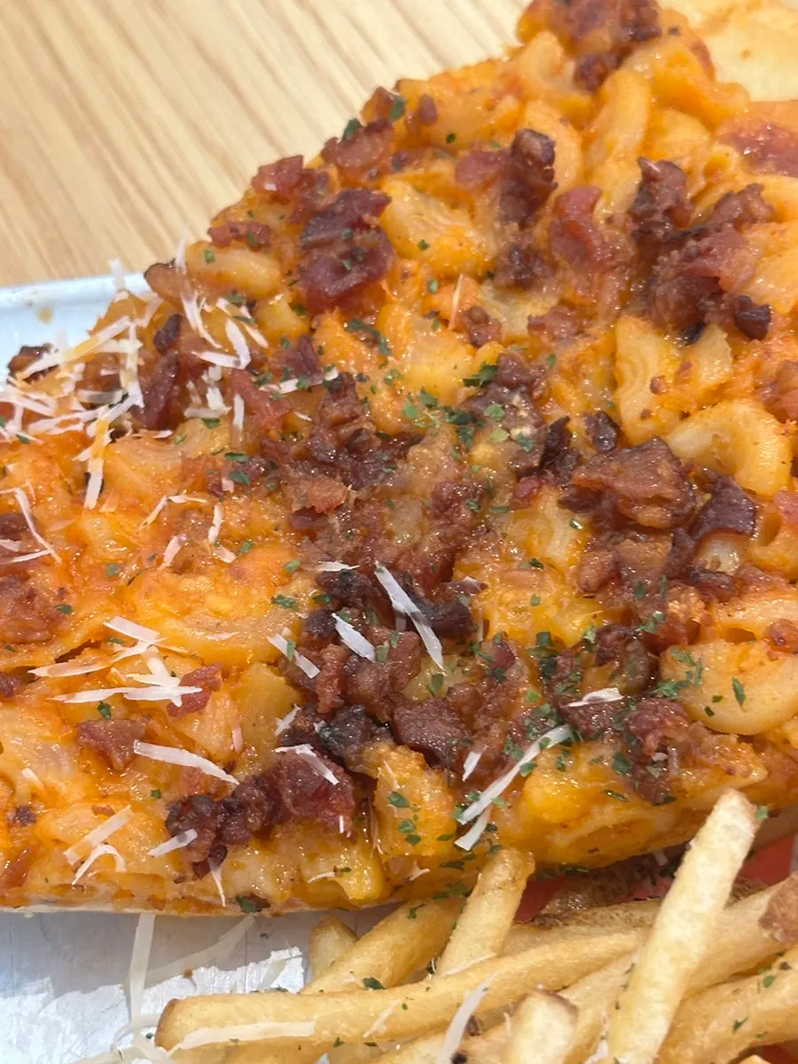 Pizza topped with mac and cheese