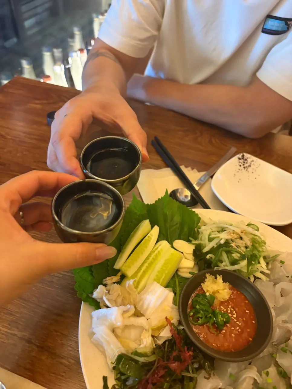 Sashimi dipped in ssamjang and other sauces