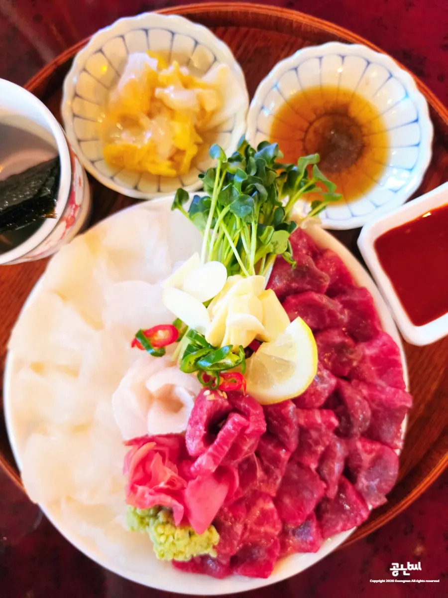 A plate of gwangban-yuksa with flounder sashimi and Korean beef yukhoe
