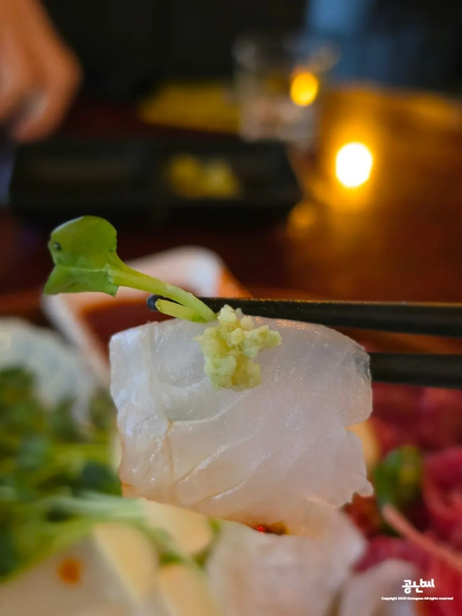 Wasabi, pickled ginger, and lemon served on the side