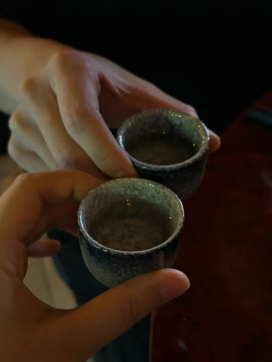 A welcome cup of sake served at Susan Sadang Main Branch