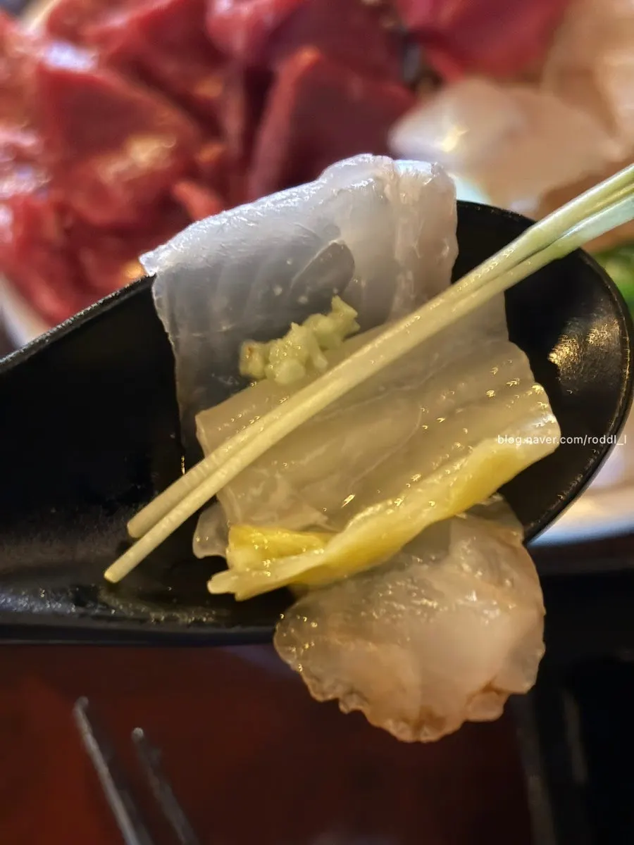 Flounder sashimi eaten with aged kimchi