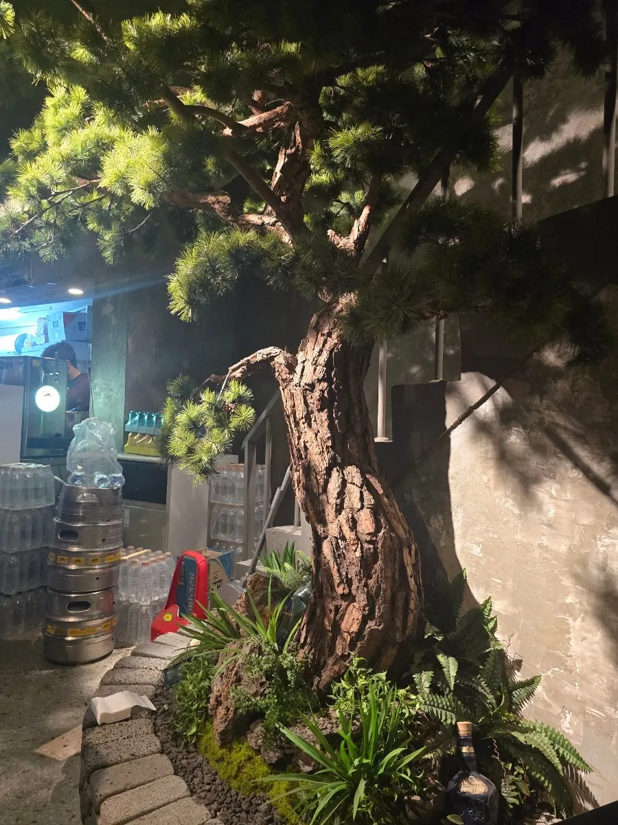 Tree decoration next to seating in the basement annex