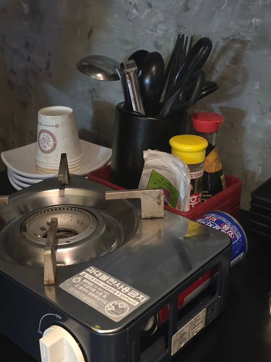 Portable burner and condiments set on the table