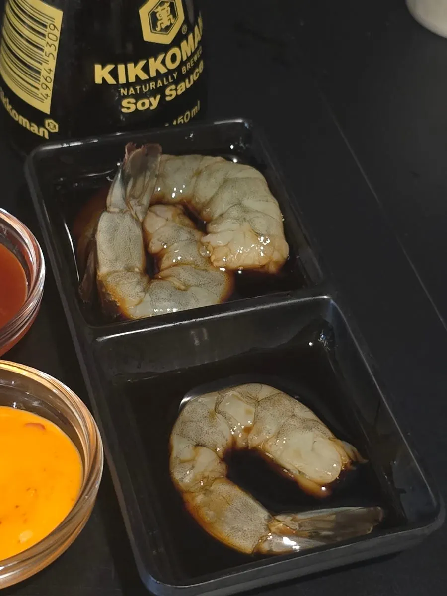 Raw shrimp sashimi wrapped in seaweed