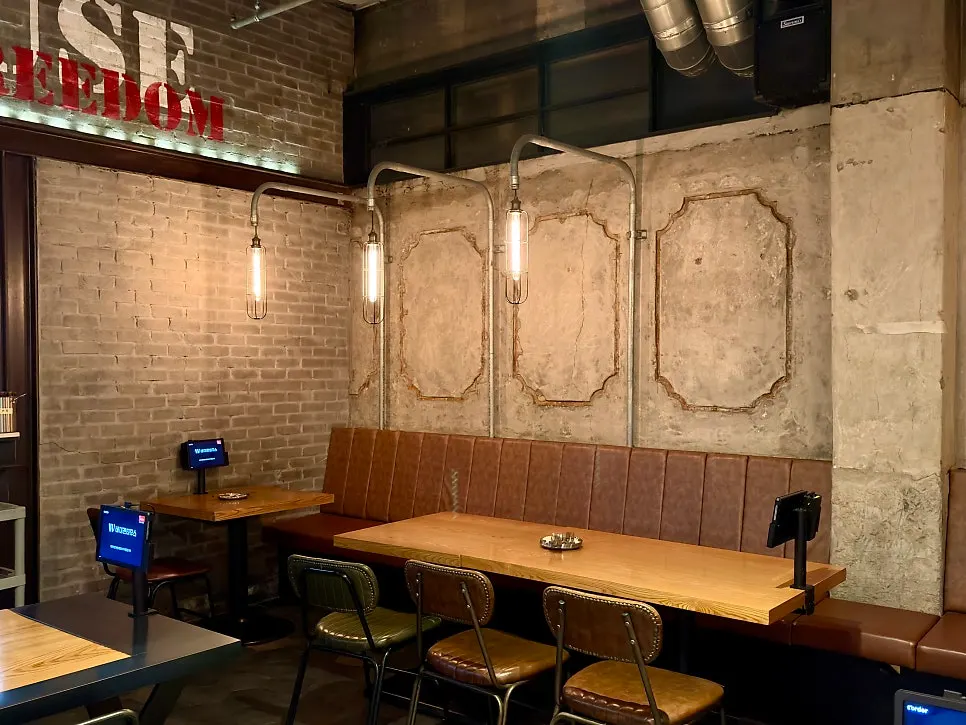 Pub interior view with wide tables