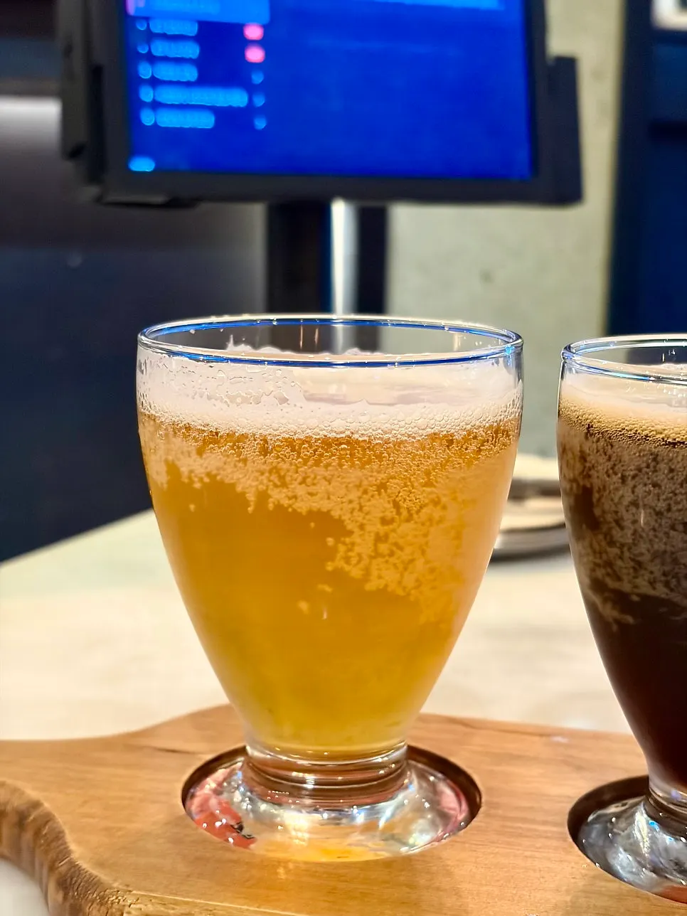 Craft beer sampler glass held in hand