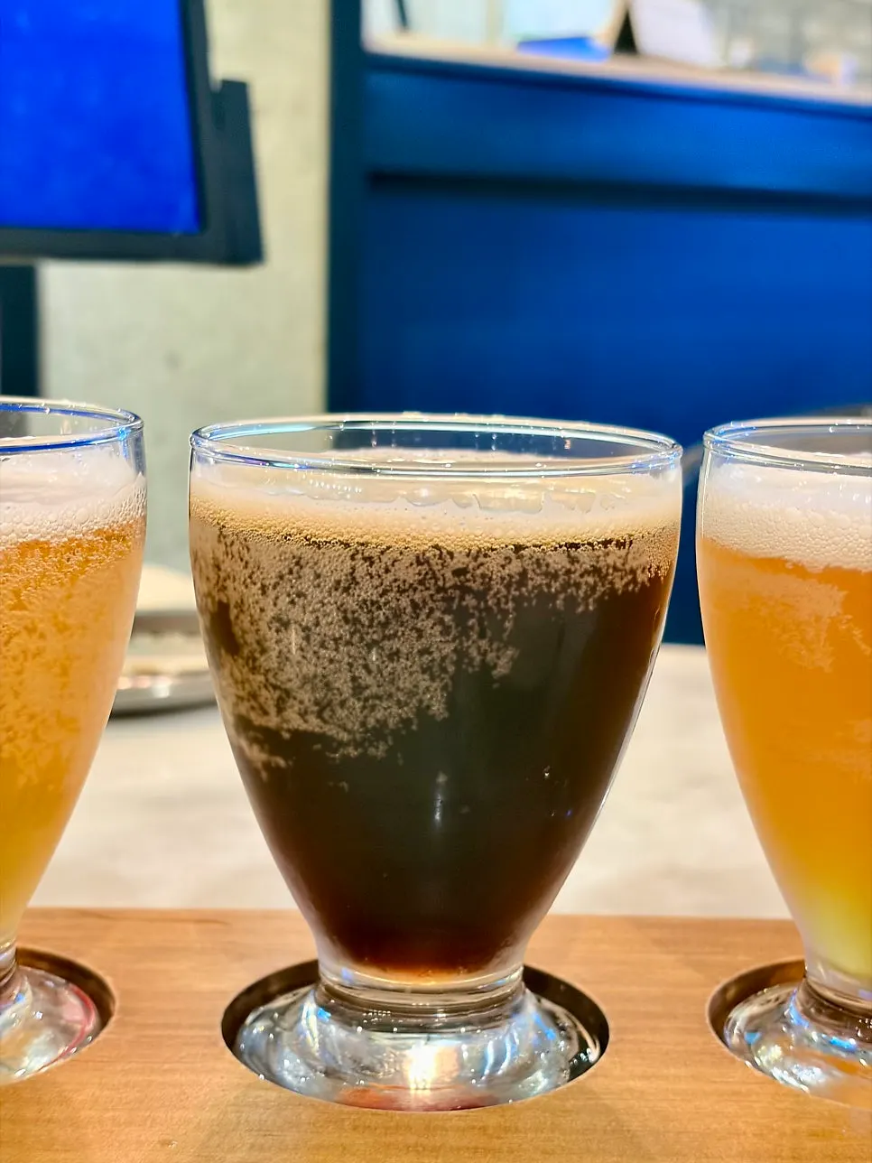 Vertical shot of a golden ale-looking craft beer