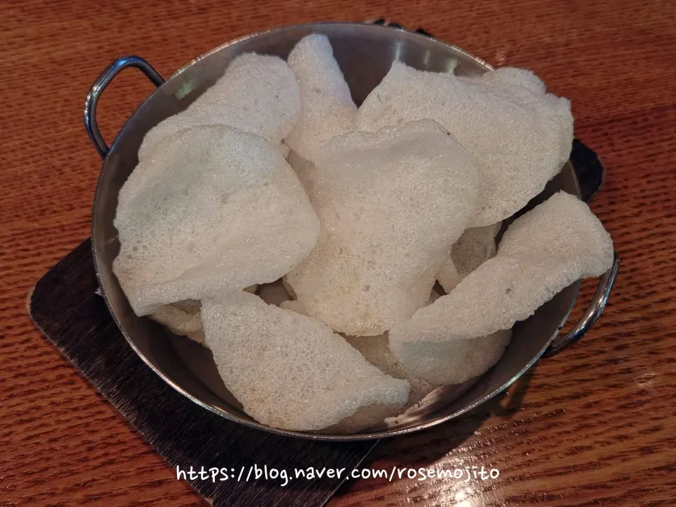 Shrimp chips served as a complimentary snack