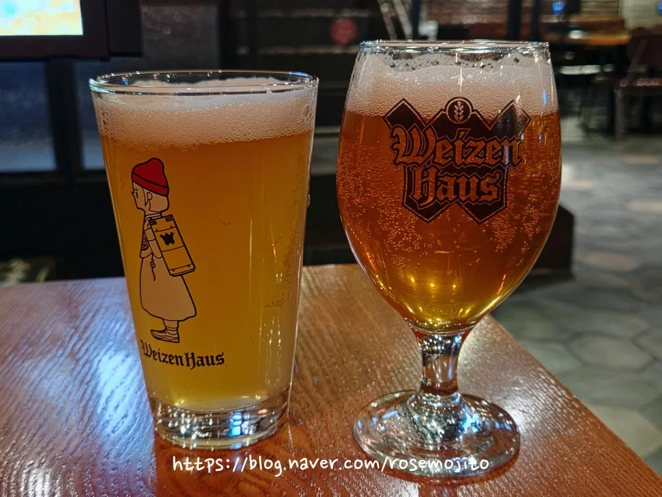 Two glasses of Weiss cloud wheat ale and Winter Sunshine green grape ale