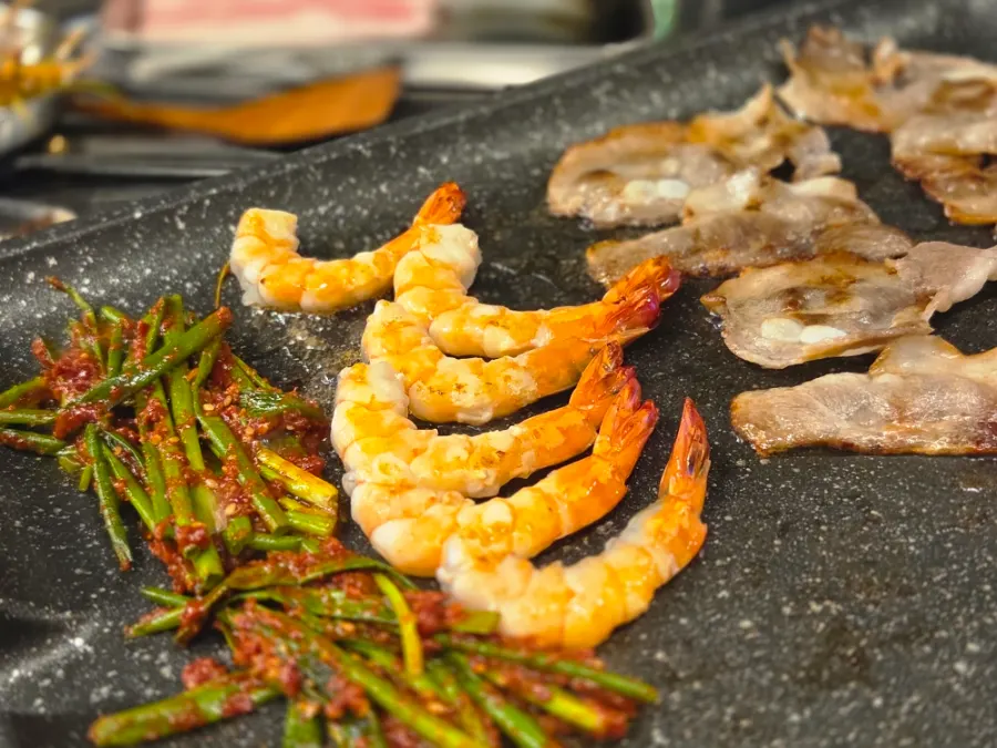 Black tiger shrimp cooking on the grill