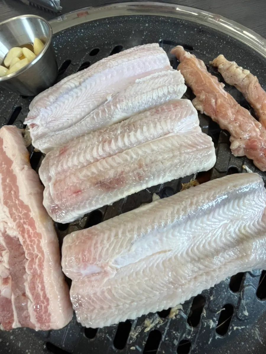 Grill loaded up with eel and meat