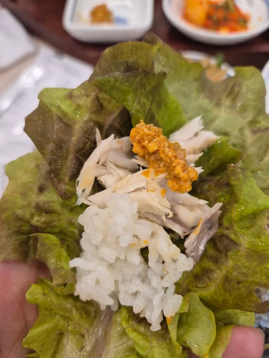 Lettuce wraps and doenjang served alongside the grilled fish