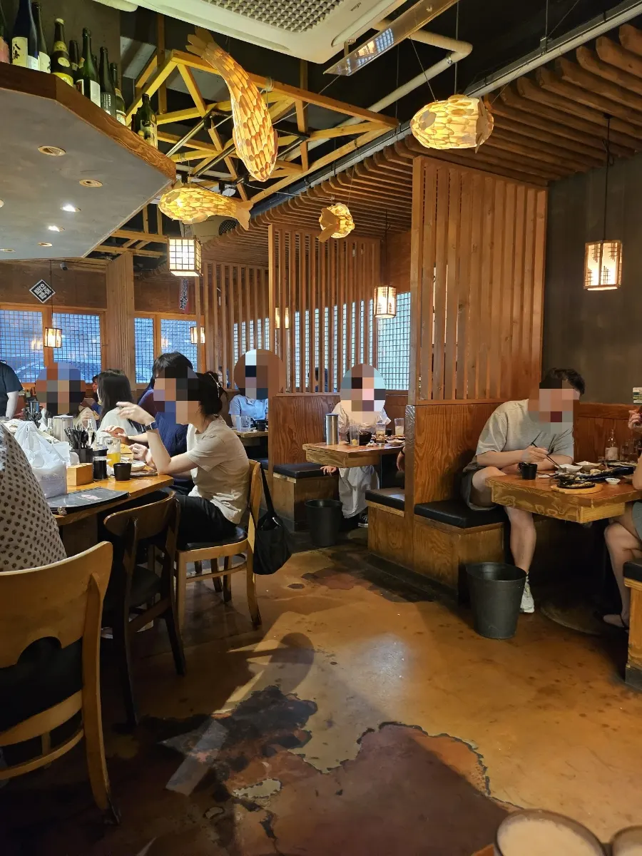 Izakaya interior with wooden fish lights