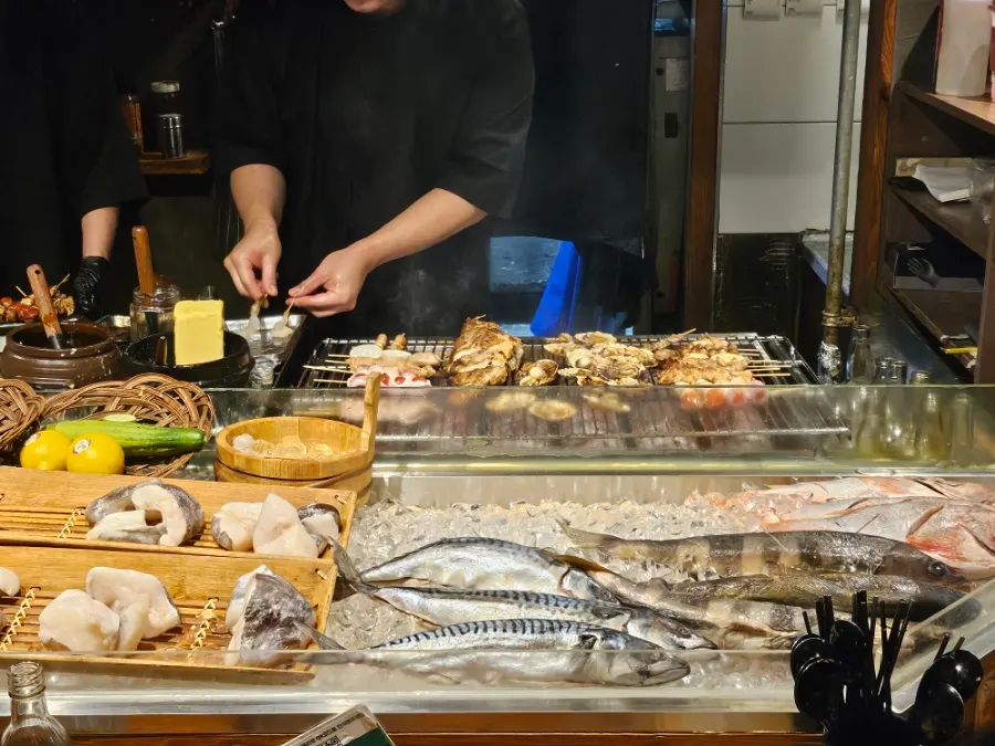 Fish on ice and skewers at the bar