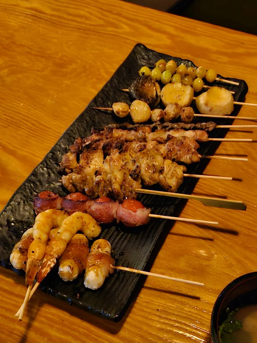 Assorted skewers on a long platter