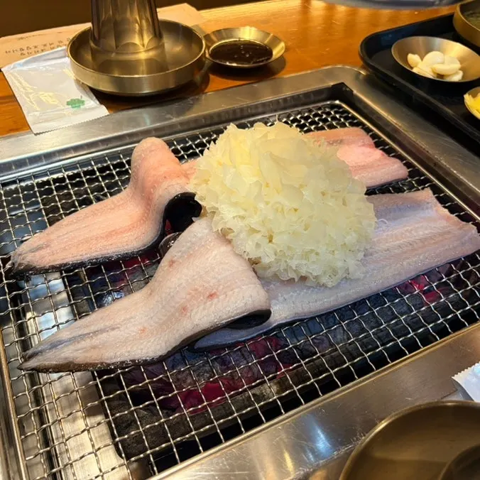 2-person set laid out with two servings of grilled eel and side dishes