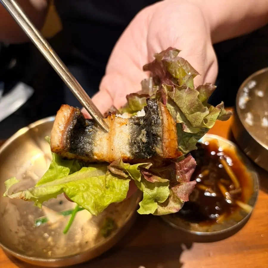 Finished eel moved to one side of the grill
