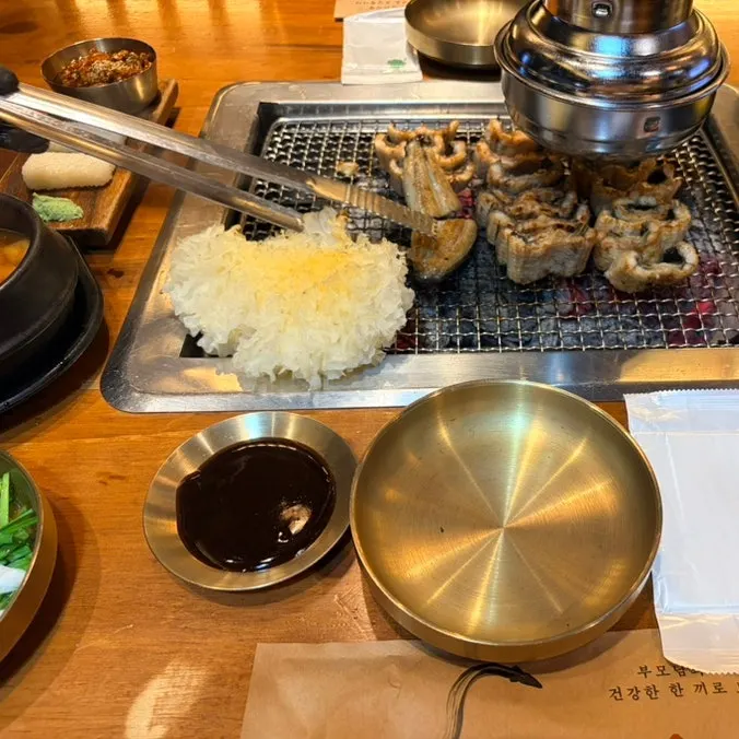 Side dishes including spicy oyster jeotgal and doenjang stew