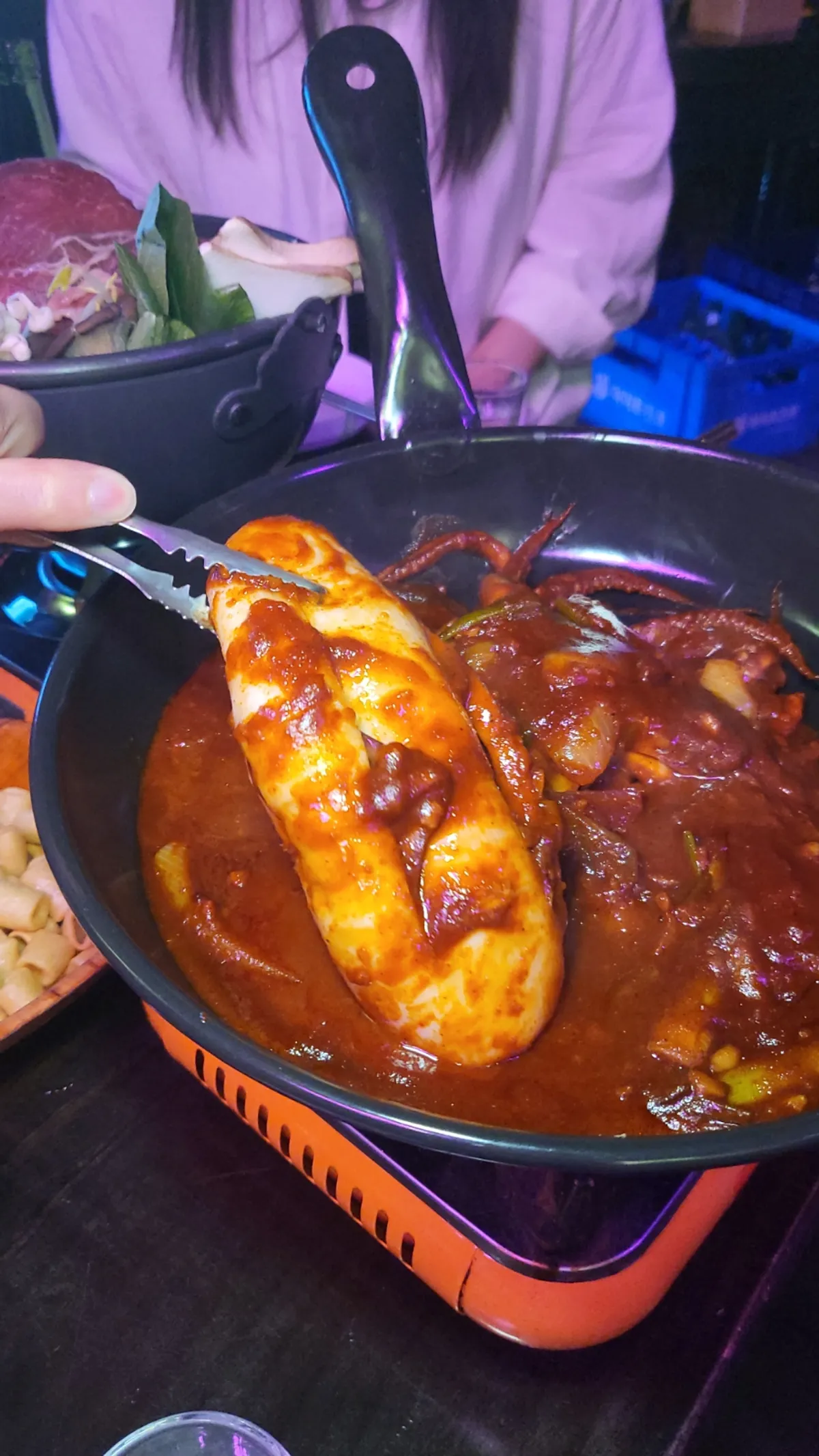 Spicy squid cut in half along with onions