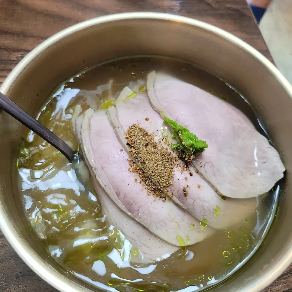 Guk-bap, meat noodles, and abalone porridge placed together on the table